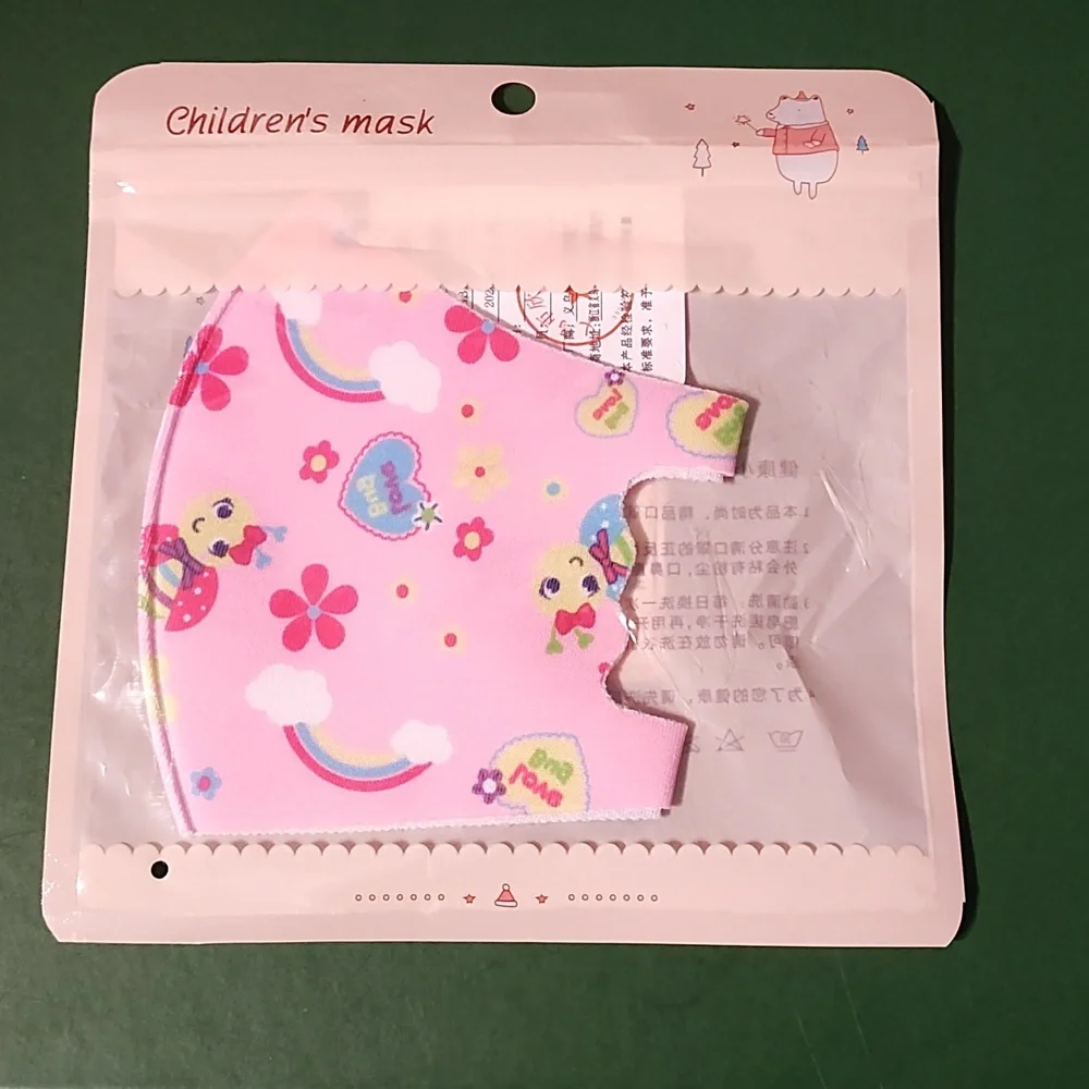 Children's re Usable face mask new in package never opened